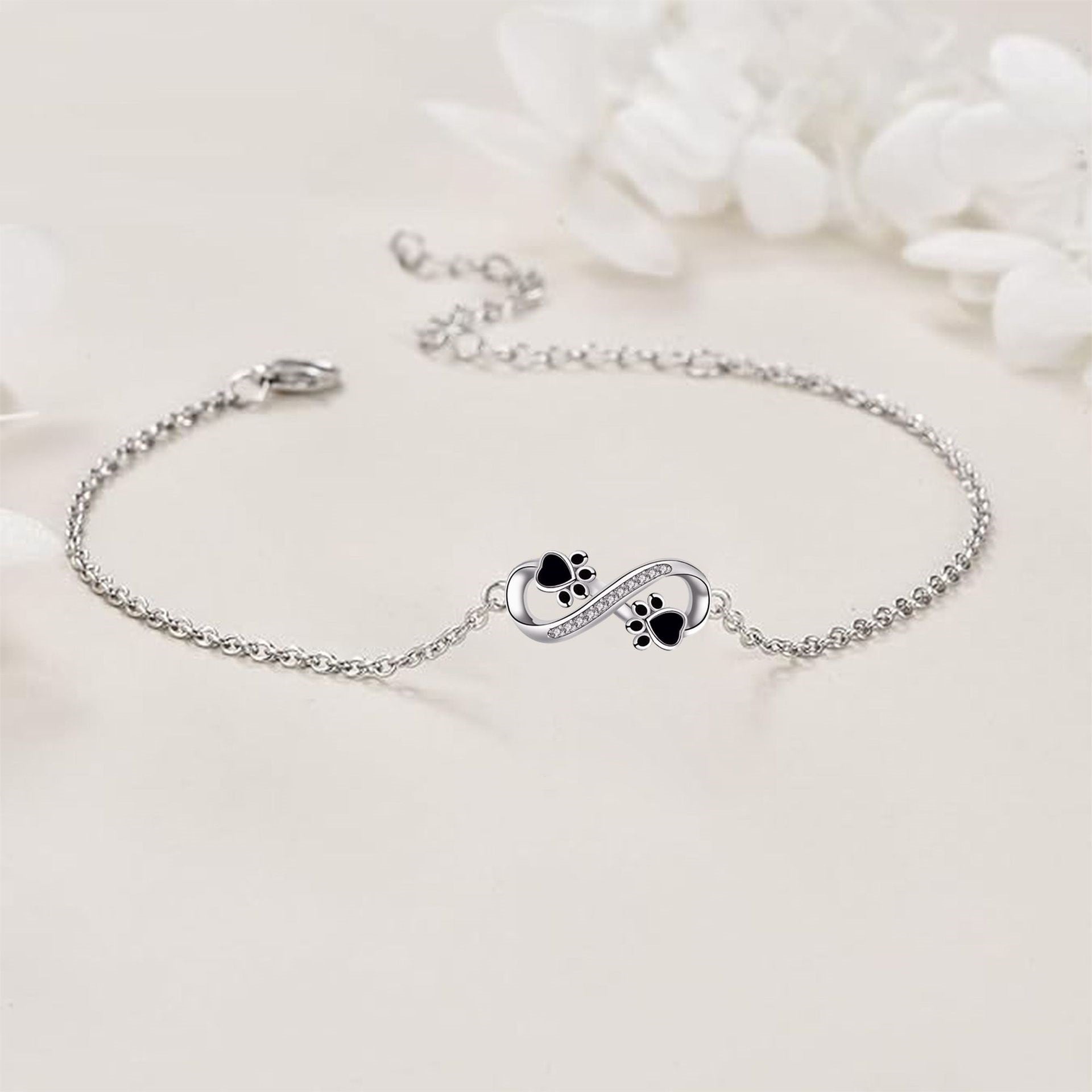 Infinity Symbol Bracelet with Paw Print Charm & Cubic Zirconia